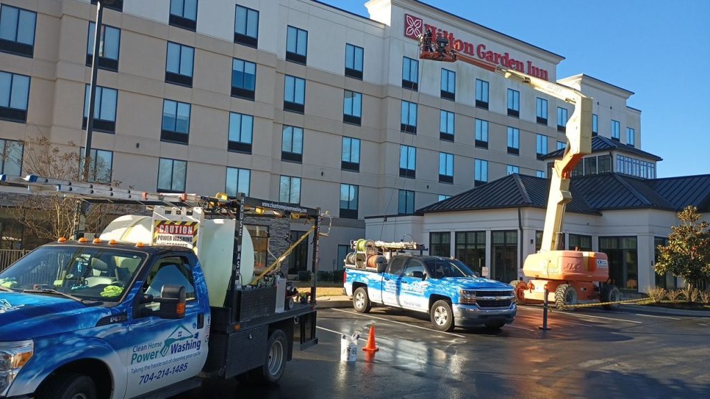 Pressure washing the walls of Hilton Garden Inn